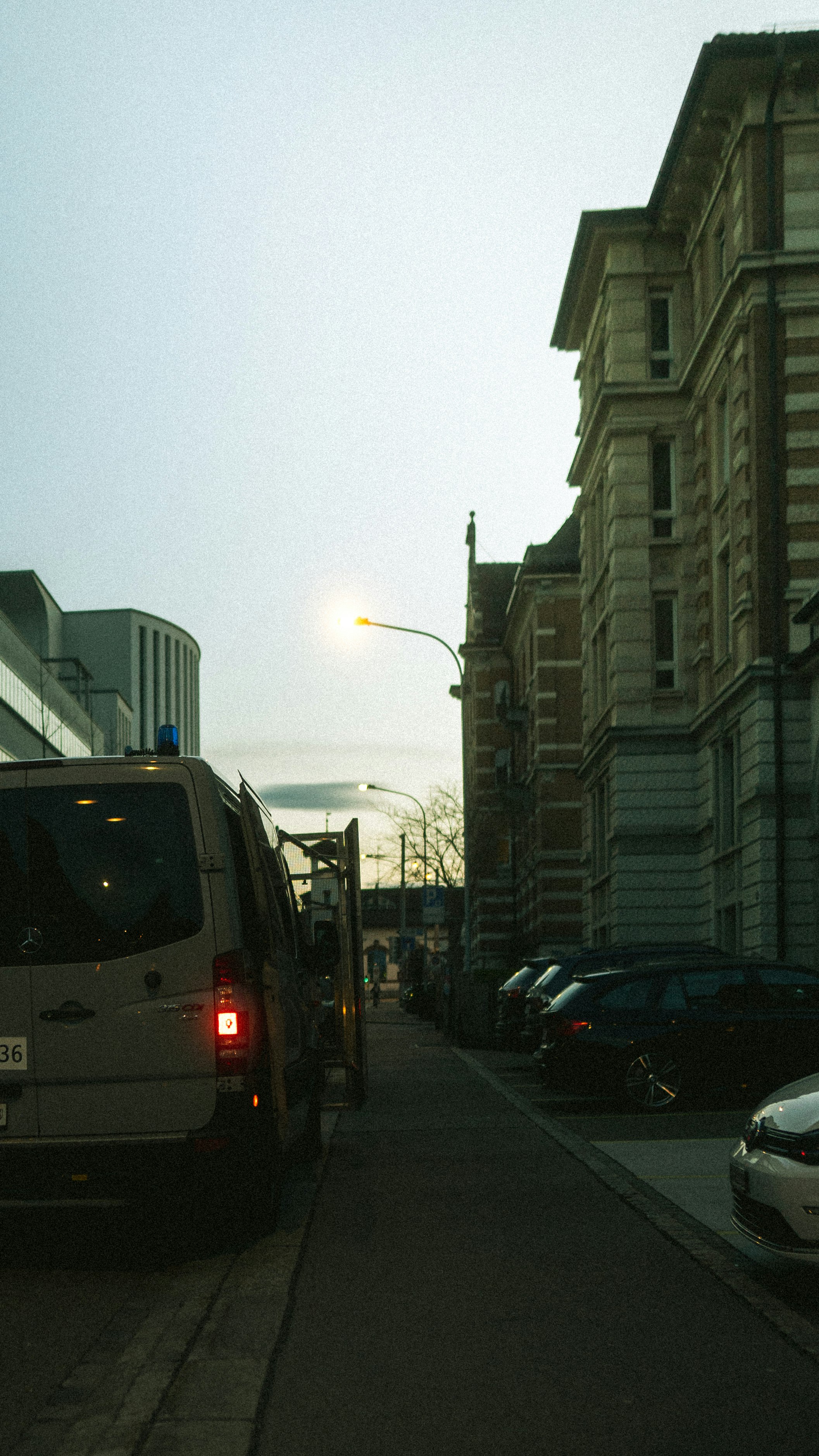 cars on road near buildings during daytime